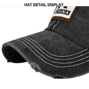 Detailed macro view of washed dark grey baseball cap featuring the CHINA patch and white stitching
