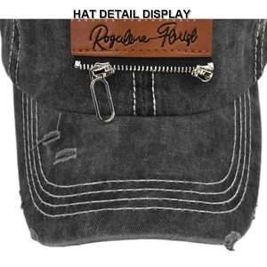 Detailed macro view of vintage washed baseball cap with metal zipper and leather patch