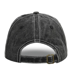 Detail of adjustable metal buckle and contrast stitching on vintage washed denim cap