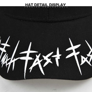 Black cotton baseball cap featuring white abstract print and long strap design details