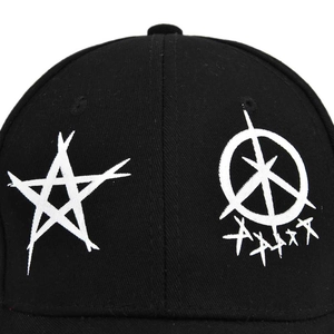 Close-up of black cotton twill baseball cap with white star and graffiti embroidery detail