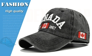 Detail of embroidered CANADA text and flag on washed dark gray cotton baseball cap