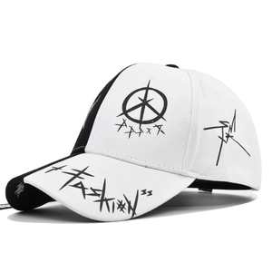 Detailed view of graffiti print on black and white cotton baseball cap with star motifs