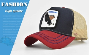 Detailed close-up of the Freedom eagle patch embroidery on the trucker cap front