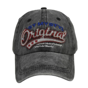 Macro shot of 3D embroidery and vintage distressed texture on charcoal baseball cap