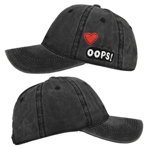 Detail of washed cotton baseball cap featuring red heart embroidery and OOPS patch