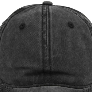 Detailed view of stitching and texture on a washed denim vintage baseball cap