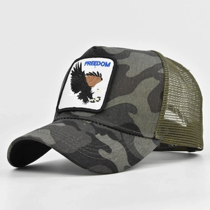 Detail of freedom eagle embroidery and olive green mesh on vintage camouflage trucker hat