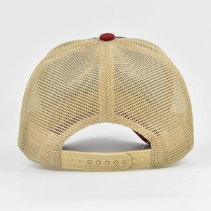 Detail of adjustable snapback closure and breathable mesh on the khaki baseball cap