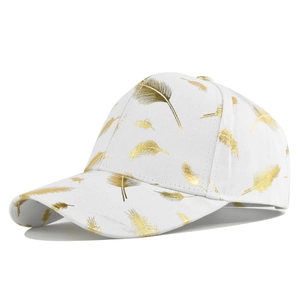 Detailed view of white canvas baseball cap with golden feather pattern prints and curved brim