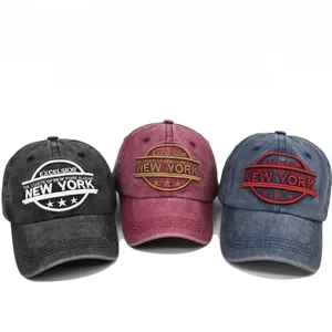 Three distressed washed cotton baseball caps with New York embroidery in various colors