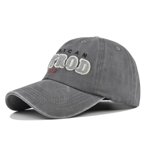 Detailed embroidery and patch work on a washed gray vintage American style baseball cap
