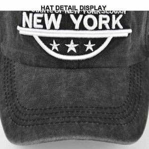 Detail of vintage washed black baseball cap with white New York 3D embroidery and stars