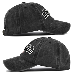 Detailed close-up showing 3D embroidery and washed cotton fabric of this baseball cap