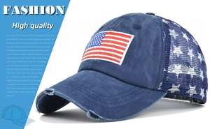 Close-up of washed denim baseball cap with American flag patch and star mesh detail