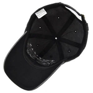 Detailed interior of vintage cotton baseball cap showing 100% cotton label and stitching