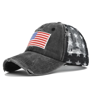 Distressed dark grey US flag embroidered mesh trucker hat with white star pattern on back