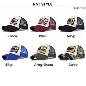 Detail view of trucker hats with embroidered patches and breathable mesh back in six colors