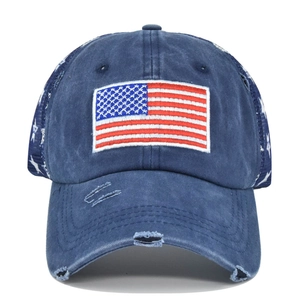 Distressed navy blue trucker hat with USA flag embroidery and star mesh detailing