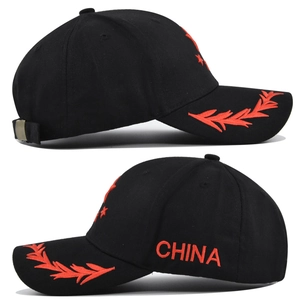 Detail of black cotton baseball cap with red China embroidery and wheat ear pattern