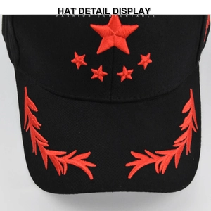 Top view of black cotton baseball cap with red embroidered stars and wheat ears