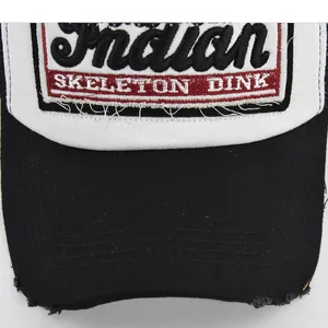 Detailed macro view of vintage distressed brim and Indian 3D embroidery on baseball cap