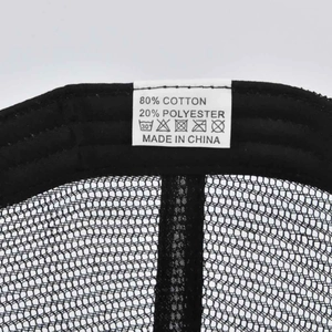 Macro view of mesh baseball cap interior with cotton blend fabric and washing label