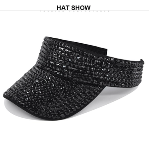 Detailed view of the black rhinestone surface on a summer open top sun visor cap