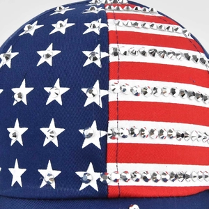 Close-up of sparkling silver rhinestones on the American flag baseball cap pattern