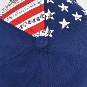 Macro detail of rhinestone-studded American flag pattern on a navy cotton baseball cap