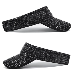 Detail of two black visor caps with rhinestones and stackable design for sun protection
