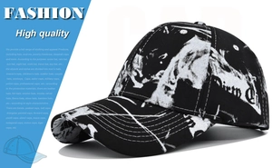 Close-up of tie-dye baseball cap with Dirty City text and black-white graffiti print