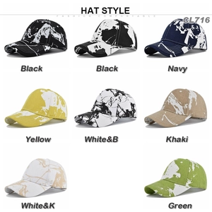 Detail view showing a variety of tie-dye graffiti patterns on cotton baseball caps