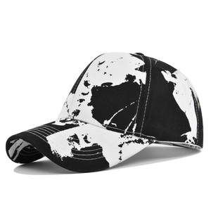 Detail view of cotton tie-dye baseball cap with abstract black and white map pattern