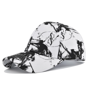 Detail of street graffiti tie-dye baseball cap showing black ink splash print patterns