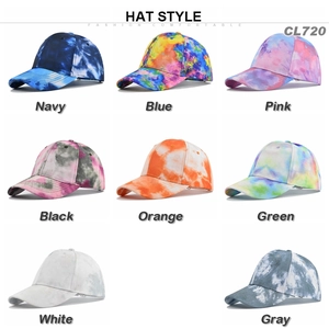 Collection of tie-dye baseball caps in various colors with curved brims for outdoor use