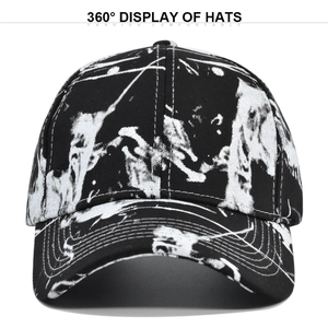 Detailed front view of tie-dye baseball cap with black and white graffiti pattern