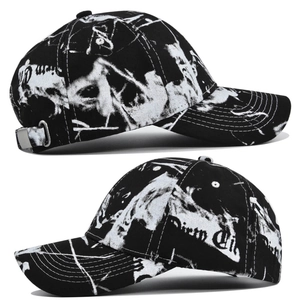 Detail view of tie-dye baseball cap with Dirty City graffiti print and metal buckle