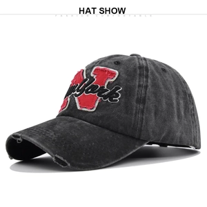 Detailed view of vintage washed cotton baseball cap with New York patch and distressed brim