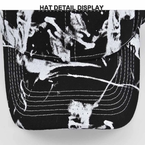 Tie-dye baseball cap with black and white ink graffiti pattern and reinforced stitching