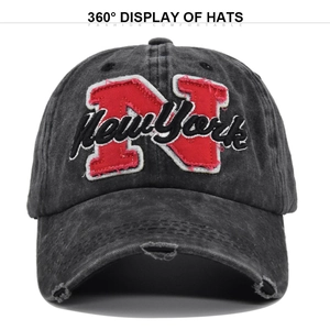 Close-up detail of vintage dark grey washed cotton baseball cap with red N embroidery