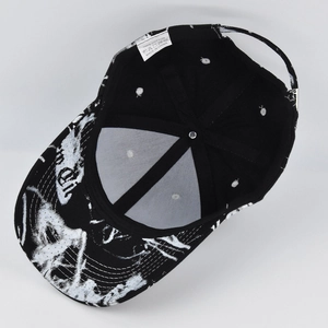 Internal view of tie-dye baseball cap showing 100% cotton label and stitching detail