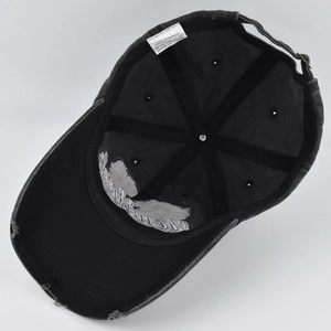 Detail shot of the internal structure and 100% cotton wash label of a vintage baseball cap