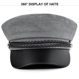 Detail of grey newsboy cap showing woven rope cord and silver metal side buttons