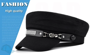 Detailed view of black baker boy hat with rhinestone strap and silver metal buckle