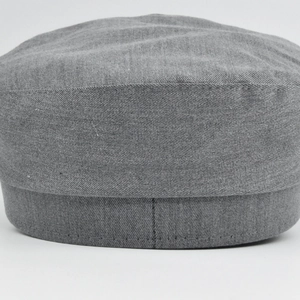 Detailed close-up showing the grey twill cotton fabric and precise stitching on the navy cap