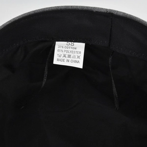 Detail view of cotton-polyester blend lining and size tag of the retro baker boy hat