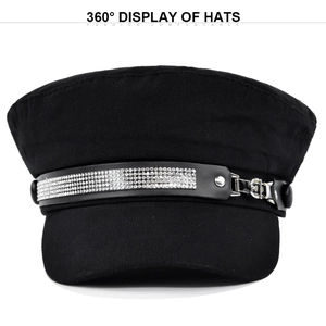 Close-up of black baker boy hat featuring sparkling rhinestones and metal buckle detail