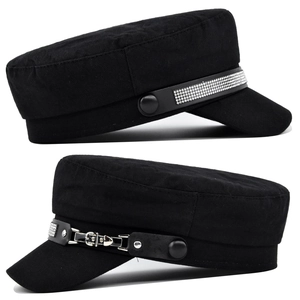 Detailed close-up of navy caps with silver rhinestones and leather band buttons