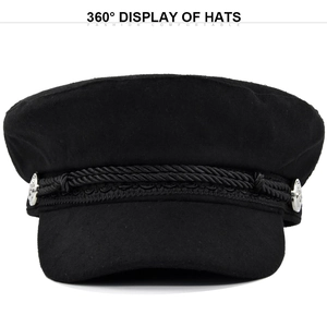 Detail of black wool newsboy hat with braided cord and silver metal side buttons